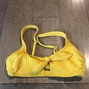 Yellow bikini top.